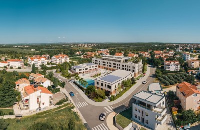 Appartamento al piano terra di un bel nuovo edificio a soli 1.000 m dal mare