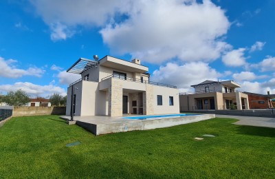 A beautiful modern villa with a swimming pool