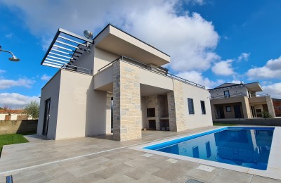 A beautiful modern villa with a swimming pool
