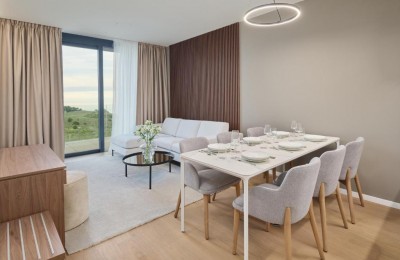 Luxury apartment with a view of the landscaped park and swimming pool in an attractive resort